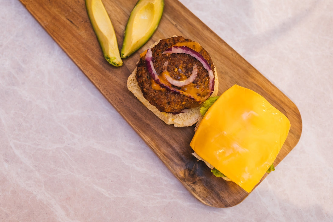 sliced bread with cheese and sliced lemon on brown wooden chopping board