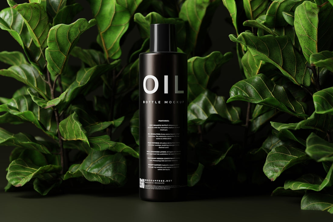 a bottle of oil sitting on top of a lush green plant