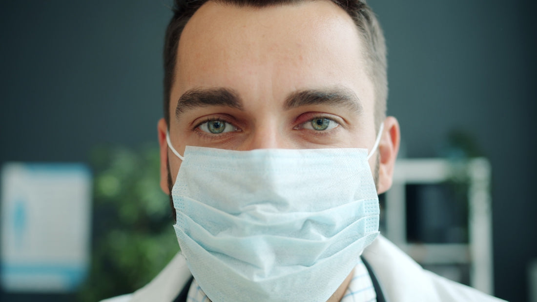 Doctor wearing a protective face mask in medical office