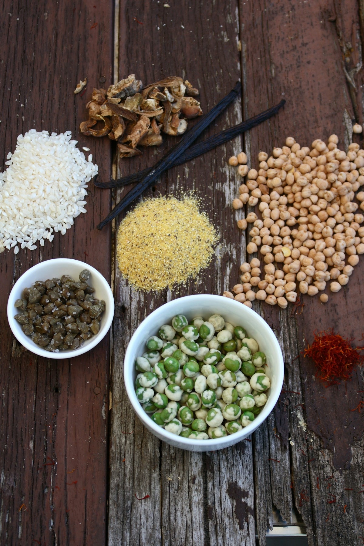 Assortment of dried ingredients and spices on wood